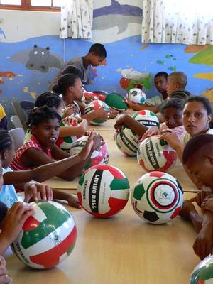 Rugby, netbal and soccer balls were handed to each child